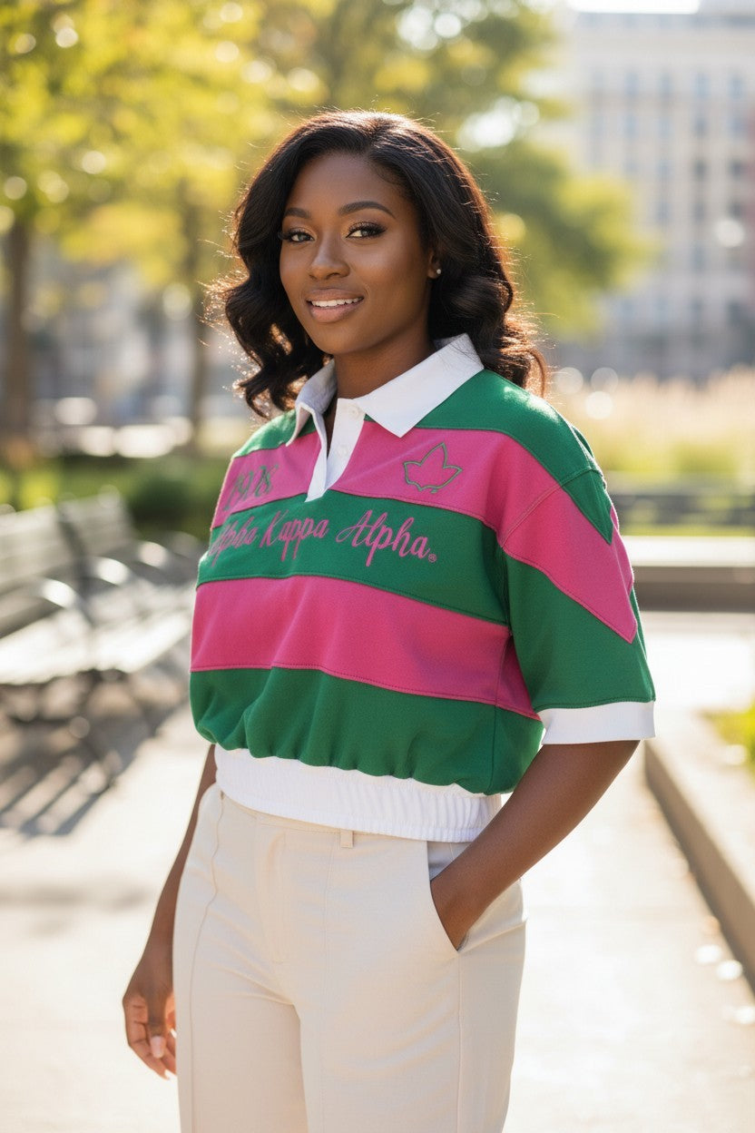 Ooh Soo Crafty LL C Sorority cropped rugby shirt in pink and green stripes with embroidered Greek letters and white collar.