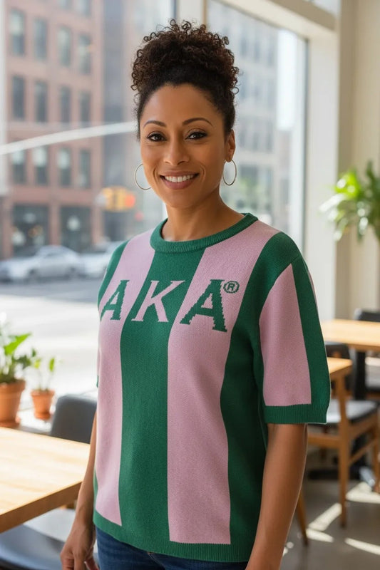 Ooh Soo Crafty LLCH AKA striped knit sweater in green and pink with short sleeves and bold lettering.